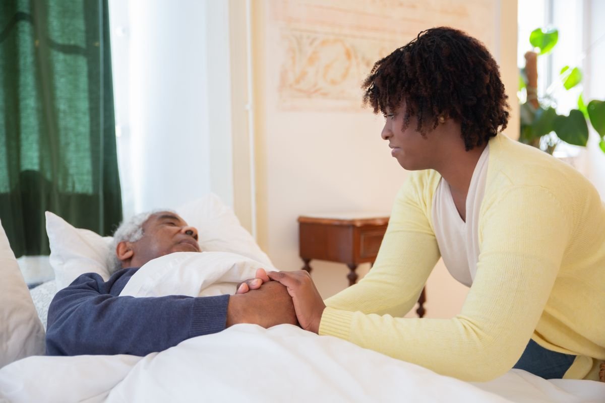 In-home caregiver supporting a patient